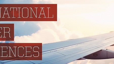 Photo of a plane wing with text on top saying International Summer Experiences