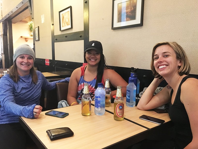 Katy Fitzgerald, Mary Sabino, Dana Buice Exchange students take a break between flights
