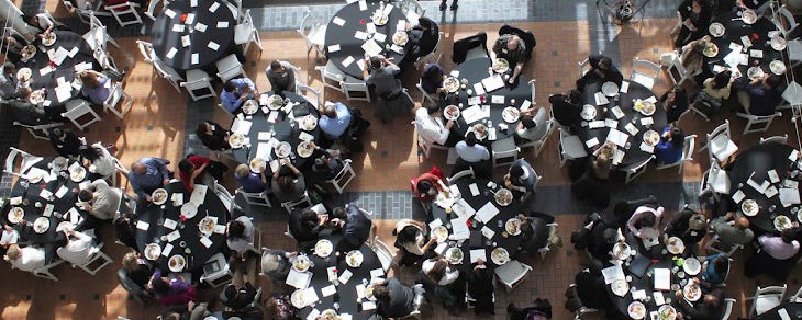 Explore with Us Aerial CEO Network students seated during a gala
