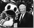Charles H. Lundquist and the UO mascot, the Duck, pose for the camera