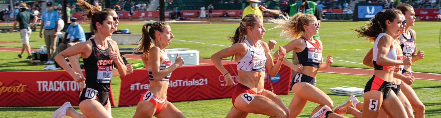 Athletes mid-stride during a track and field event