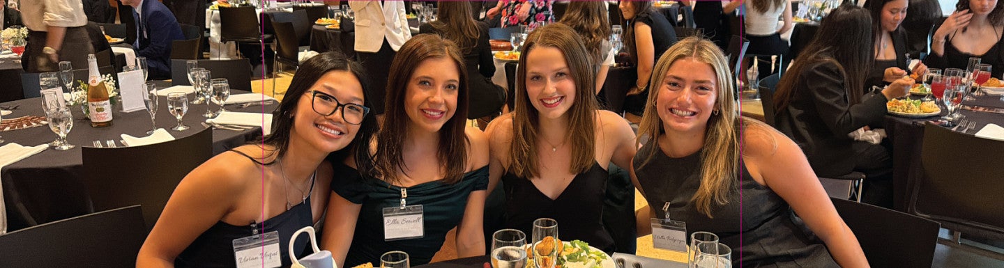 Student club members pose for a group photo while seated at a table during the 2025-2026 Dean's Council for Inter-Club Coordination End of Year Gala 