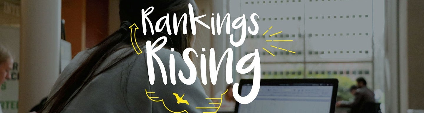 The phrase 'rankings rising' over a photo of a student studying on a laptop