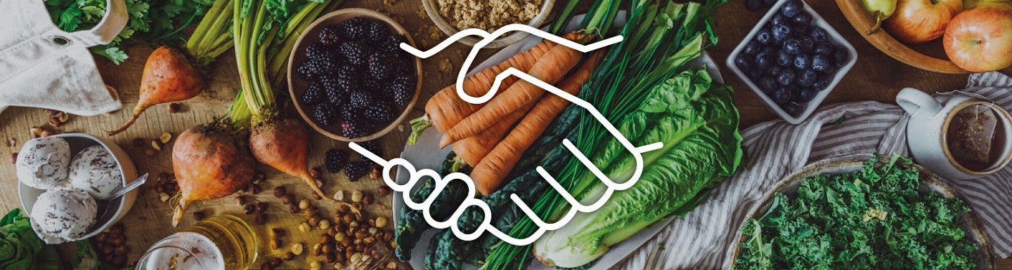 White lineart icon of two shaking hands against a backdrop of various produce