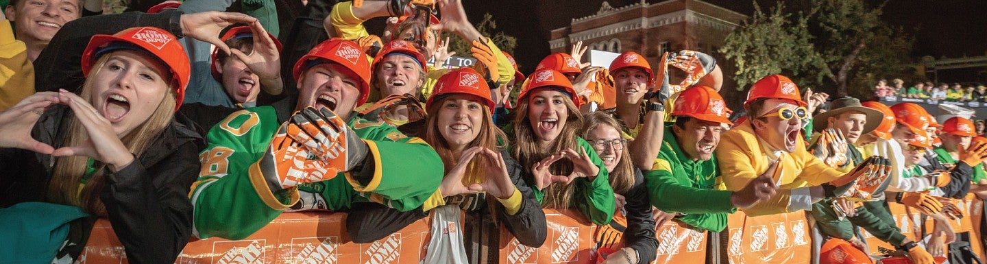 A crowd of students throw the O during College GameDay