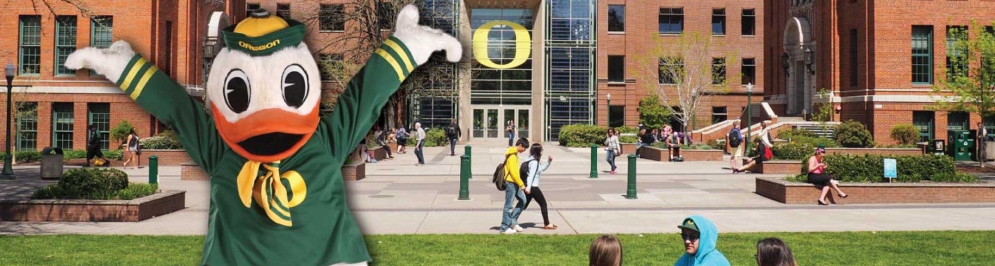 A faux-3D design of the Duck mascot in front of the Lillis Business Complex