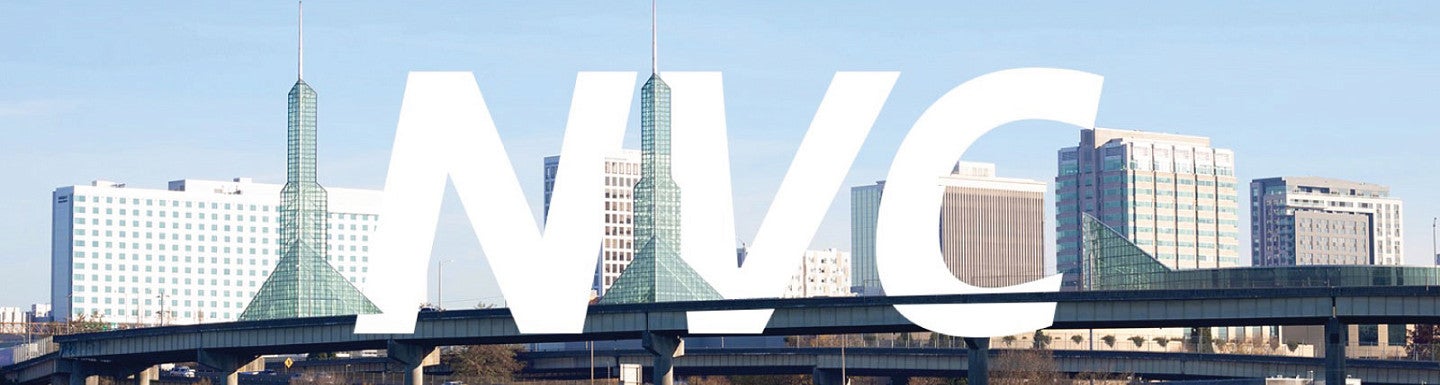 The letters NVC in white against a background of the Portland city skyline