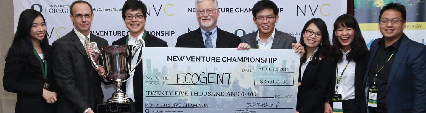 NVC 2015 Grand Prize Winning Team Ecogent in front of NVC Banner with trophy