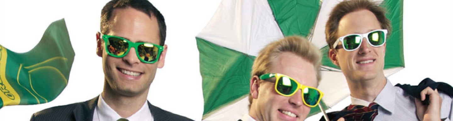 Three students wear sunglasses while being wind blown from the magazine cover