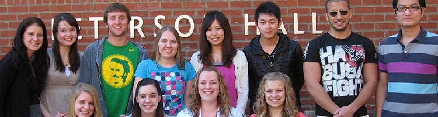A group of peer advisors in front of Peterson Hall