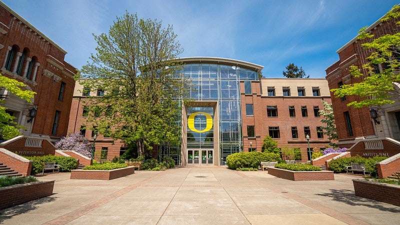 Exterior photo of the Lillis Business Complex on a sunny day in spring