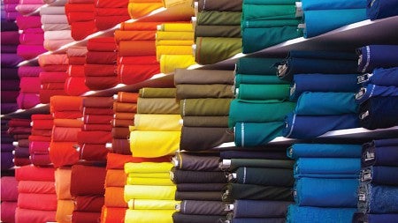 Stacks of brightly-colored textiles