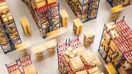 A photo taken from above looking down at rows of shelves in a shipping facility