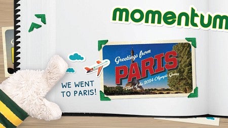 The hand of the UO Duck mascot points to a scrapbook page bearing the word "Momentum" and a postcard of Paris next to the text "We went to Paris!"