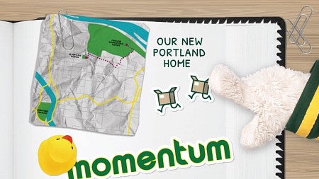 The hand of the UO Duck mascot points to a scrapbook page bearing the word "Momentum" and a map of Portland alongside the text "Our new Portland home."