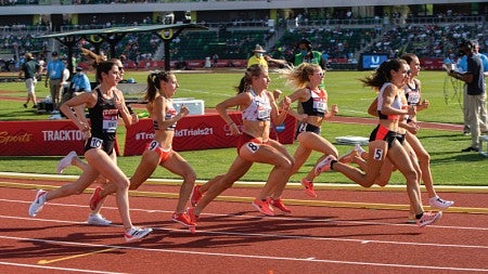 Athletes run on the track at UO's Hayward Field