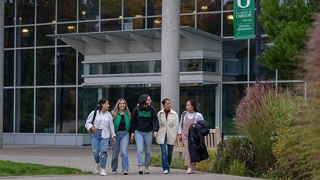 SPM students chat as they walk together on UO's new Portland campus