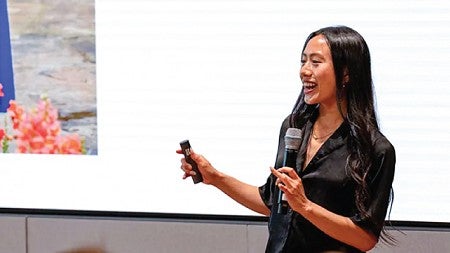 A participant at the V10 Builder Residency program speaks to the crowd