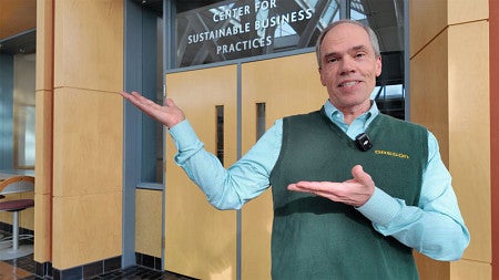 Dean Blonigen gestures while standing in front of the CSBP suite entrance