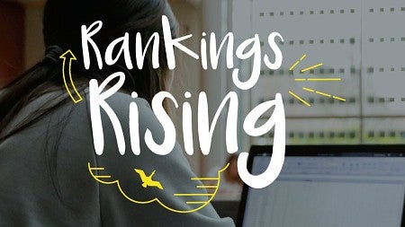 The phrase 'rankings rising' over a photo of a student studying on a laptop