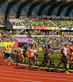 Track athletes are pictured mid-stride during a race at UO's Hayward Field