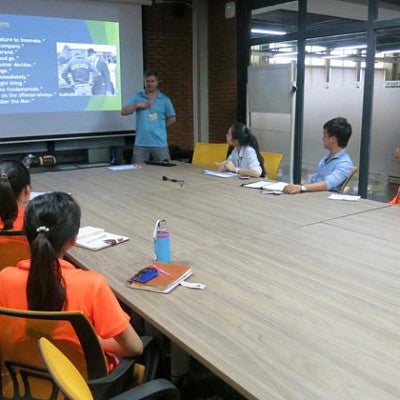 Brian Warner leads an English class in Vietnam