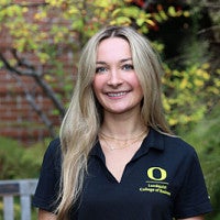 Student wearing Lundquist College of Business polo