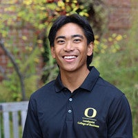 Student wearing Lundquist College of Business polo