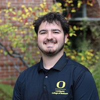 Student wearing Lundquist College of Business polo